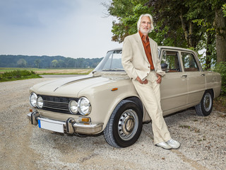 man in front of his car