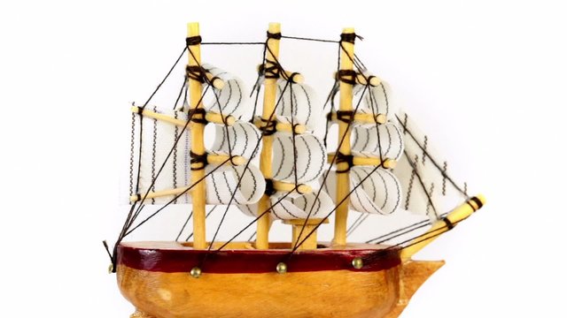 Toy wooden ship circling isolated