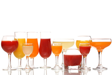 Tropical juices in glasses isolated on white