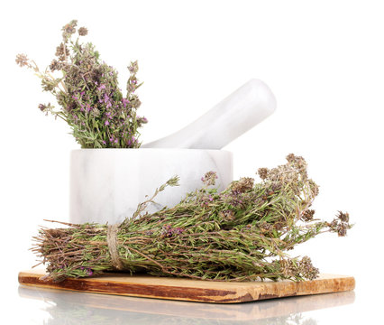 Thyme herb and mortar isolated on white
