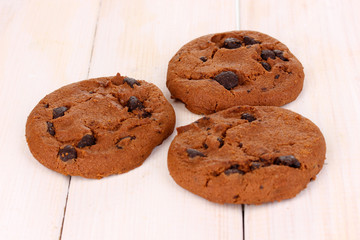 Chocolate chips cookie on wooden background