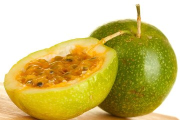 Obraz na płótnie Canvas green passion fruit on white background close-up
