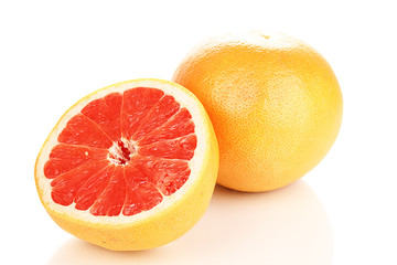 Ripe grapefruit and half isolated on white