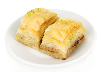 Sweet baklava on plate isolated on white