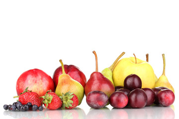 Mix of ripe sweet fruits and berries isolated on white