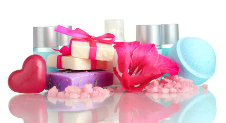 cosmetic bottles, soap and flower, isolated on white.