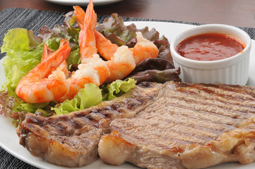 Grilled rib steak close up with shrimp