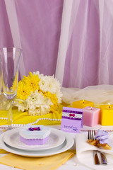 Serving fabulous wedding table in purple and yellow color