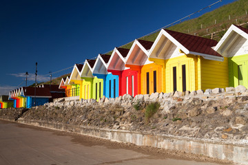 Beach huts at sunrise in Great Britain
