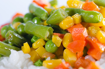 Rice and sautéed vegetables close up