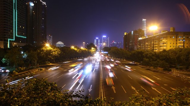 Cars go on night high-speed road