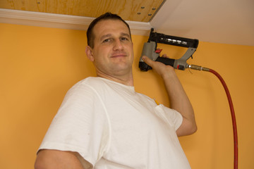 Handyman with nail gun