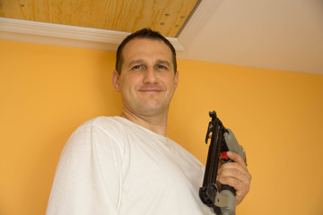 Handyman with nail gun