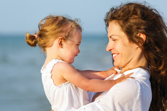 Mother and daughter on the beach
