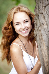 Redhead girl in the park.