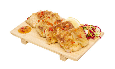 Fried fish fillets with  salad.