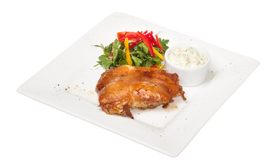 roasted chicken with vegetables on a white plate