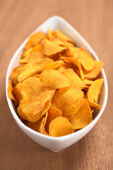 Crispy Peruvian sweet potato chips in white ceramic  bowl