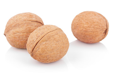 Three walnuts on white