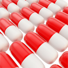Medicine pill glossy red and white capsules background