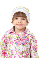 Portrait of a charming little girl in a cap