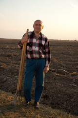 farmer with spade and pitchfork