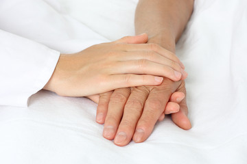 Patient hand in bed