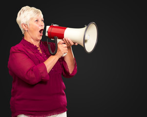 Naklejka premium Portrait Of A Senior Woman With Megaphone