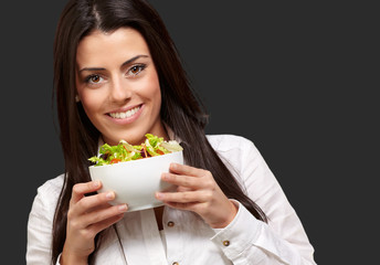 Young Girl Showing A Bowl Of Salad