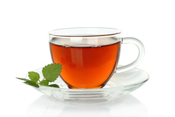 Tea cup with melissa leaves on a white background