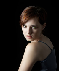 young woman with nice face on dark background
