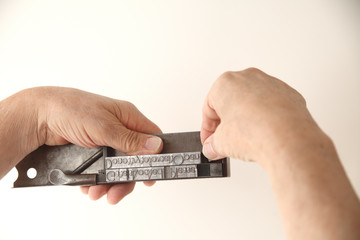 using composing stick to set type