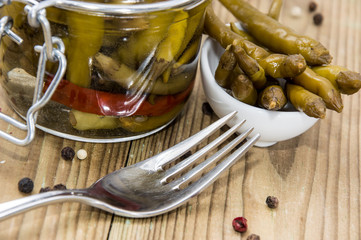 Glass filled with pickled Chilis