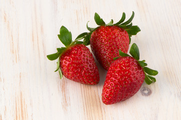 Three fresh strawberries