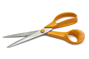 Orange scissors isolated on white background