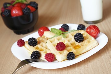 Fresh waffles with fruit for breakfast