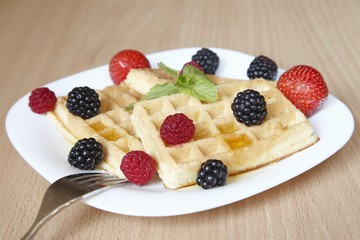 Fresh waffles with fruit for breakfast