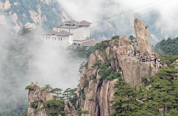 Cloudscape of  Huangshan (yellow mountain). Traveling people.