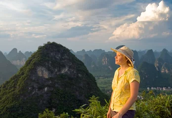Foto op Canvas lovely young women at sunset on top of the Moon Hill. Guilin © petunyia