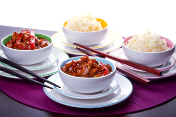 Chinese bowls with rice and sweet and sour chicken