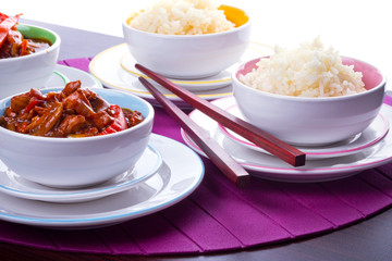 Chinese bowls with rice and sweet and sour chicken