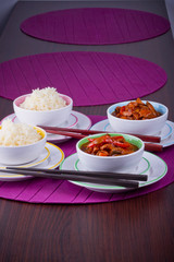 Chinese bowls with rice and sweet and sour chicken
