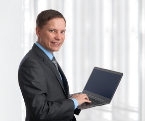 businessman with laptop computer in office