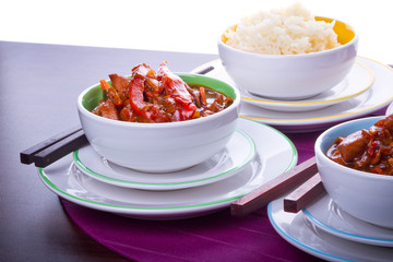 Chinese bowls with rice and sweet and sour chicken