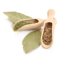 Foto op Canvas wooden shovels with spices on  bay leaves isolated on white © Africa Studio