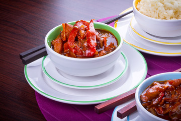 Chinese bowls with rice and sweet and sour chicken