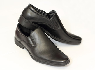 man's black shoes isolated on white background