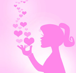 silhouette of girl blowing hearts