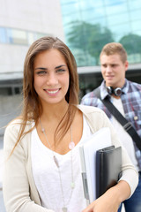 Fototapeta premium Portrait of student girl walking on university campus