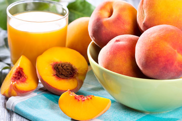 Naklejka na ściany i meble fresh peaches and glass of juice
